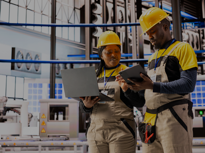 Utility workers in hard hats and safety vests